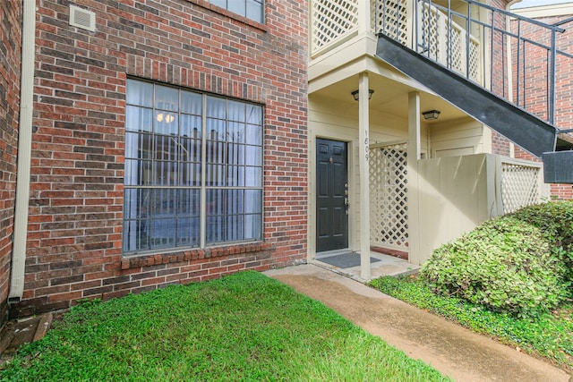 property entrance with a balcony