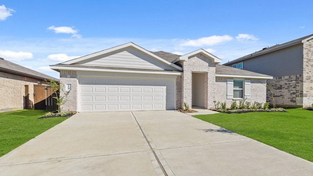 view of front facade with a garage and a front lawn