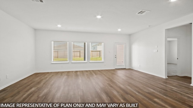 unfurnished room featuring dark hardwood / wood-style flooring