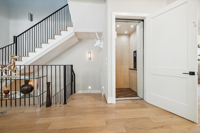 staircase with wood-type flooring