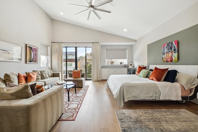 bedroom featuring access to exterior, high vaulted ceiling, wood-type flooring, and ceiling fan