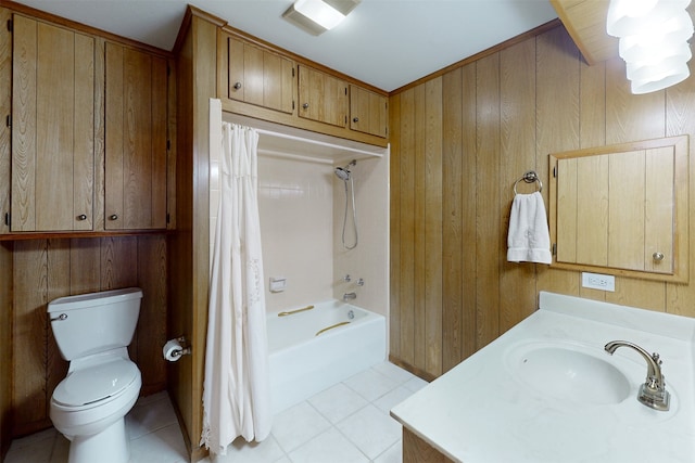 full bathroom with toilet, tile patterned floors, wooden walls, and shower / bath combination with curtain