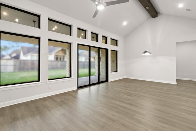 unfurnished room featuring beamed ceiling, ceiling fan, high vaulted ceiling, and hardwood / wood-style flooring