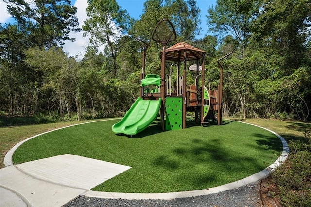 view of jungle gym with a lawn