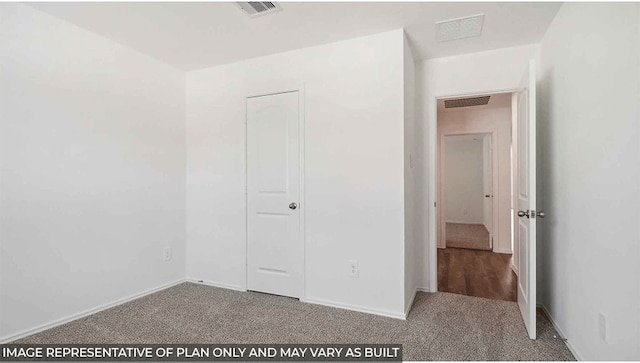 unfurnished bedroom with carpet floors