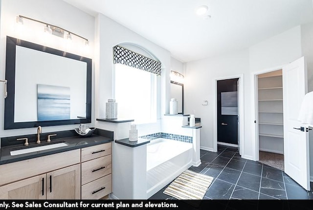 bathroom featuring vanity and a tub