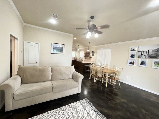 living room with ornamental molding, sink, and ceiling fan