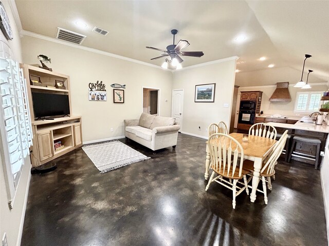 living room with ornamental molding, sink, and ceiling fan