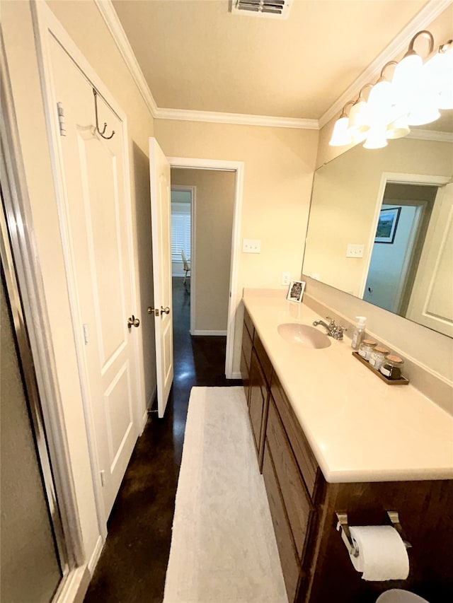 bathroom with vanity and ornamental molding