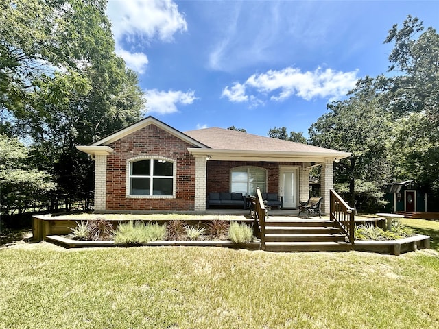 view of front of home with a wooden deck and a front yard