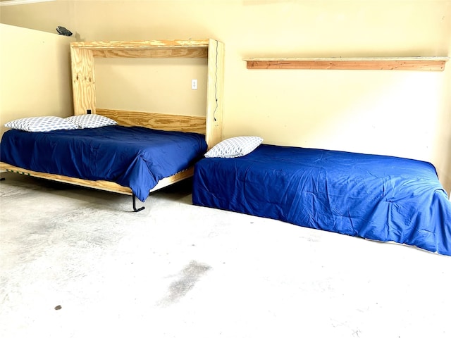 bedroom with concrete flooring