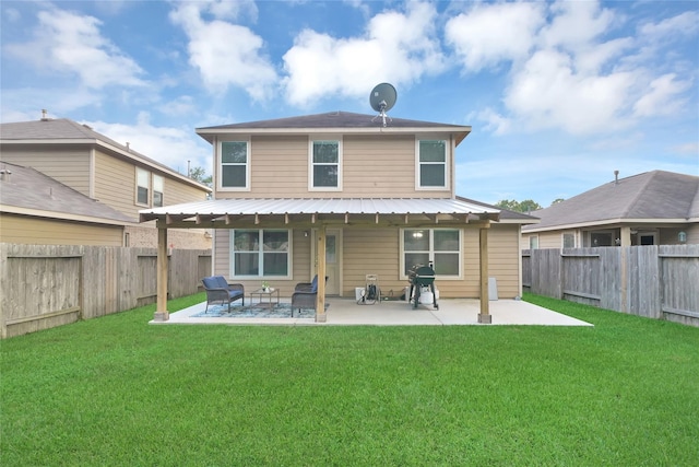 back of property with a patio area and a lawn