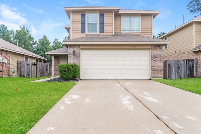 view of front property with a garage and a front yard