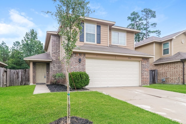 view of front of home with a garage and a front lawn