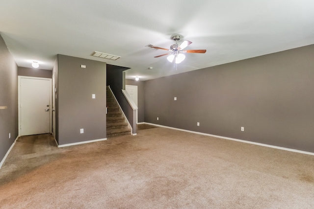 unfurnished room featuring carpet and ceiling fan