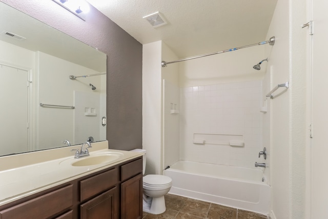 full bathroom with tile patterned flooring, a textured ceiling, toilet, bathing tub / shower combination, and vanity