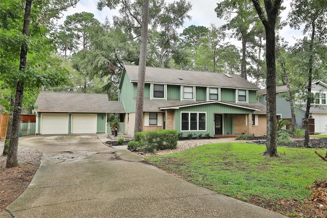 view of front of house featuring a garage and a front lawn