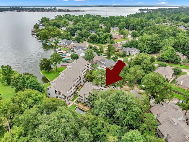 birds eye view of property with a water view