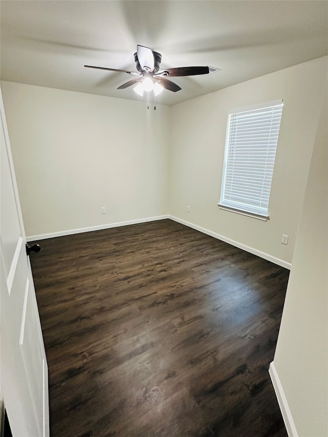 empty room featuring hardwood / wood-style floors and ceiling fan