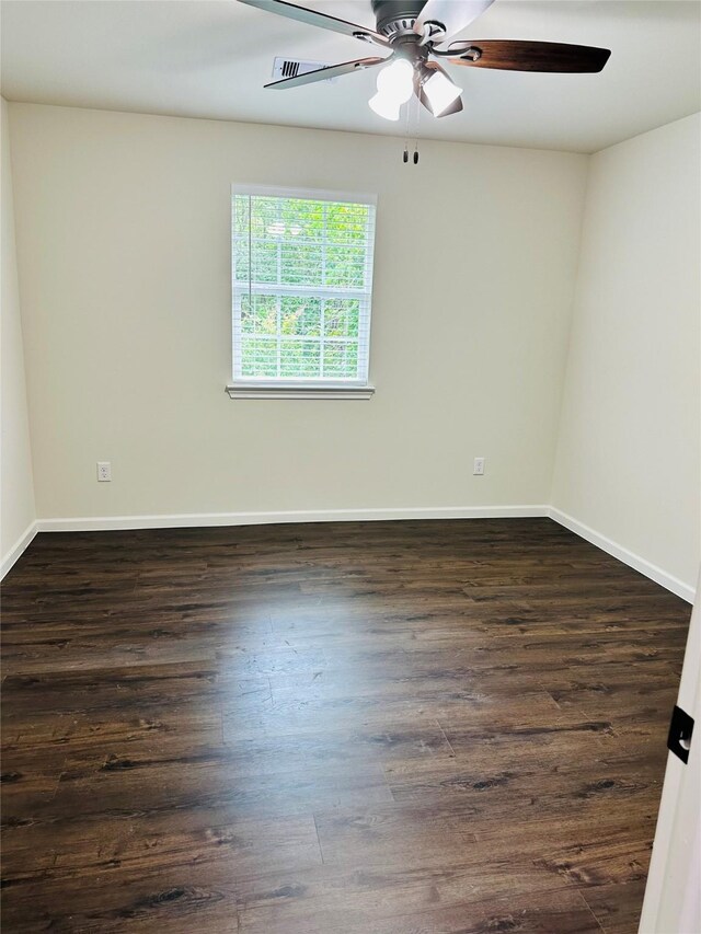 spare room with ceiling fan and hardwood / wood-style flooring