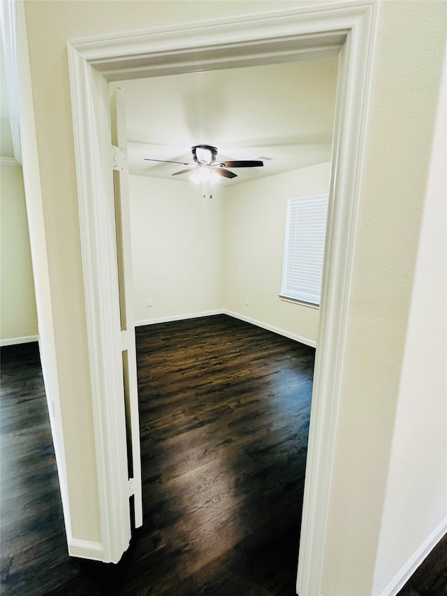 unfurnished room featuring ceiling fan and wood-type flooring