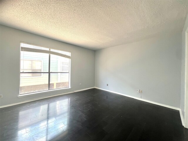 empty room featuring a textured ceiling