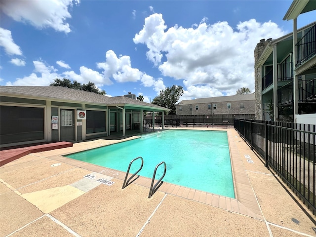 view of swimming pool featuring a patio area