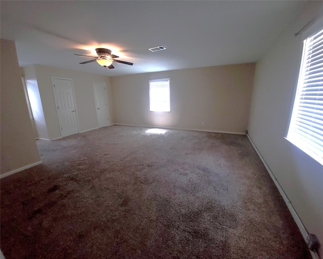 carpeted empty room with ceiling fan