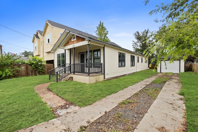 bungalow with a porch, a garage, an outdoor structure, and a front yard