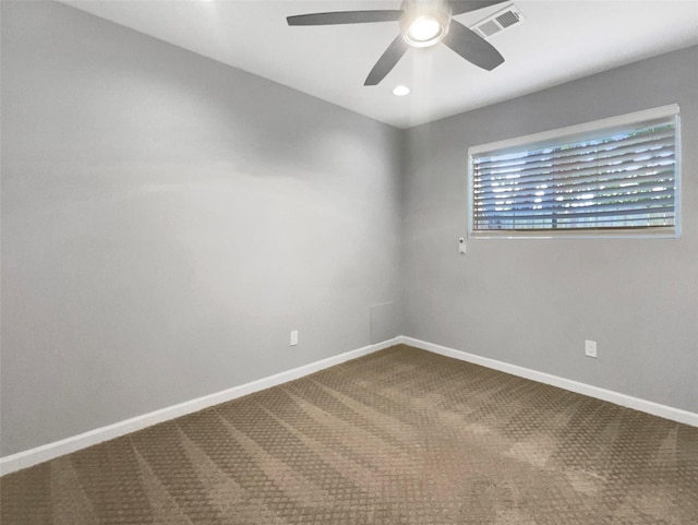 carpeted empty room featuring ceiling fan