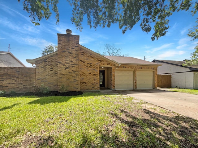 view of front of house featuring a garage and a front yard