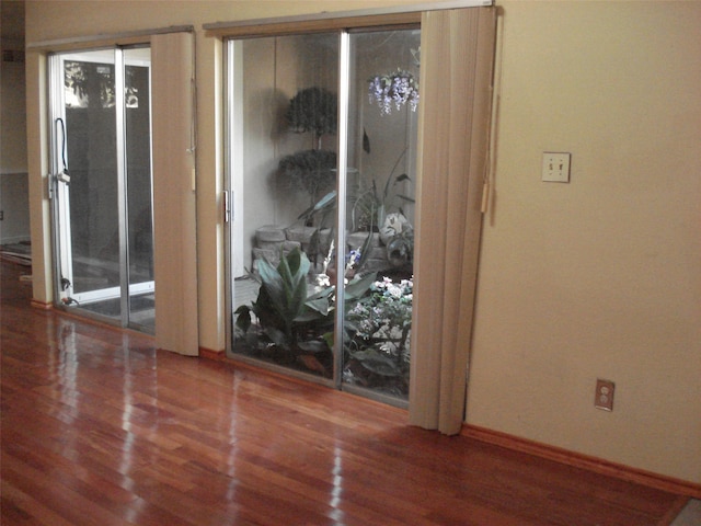 interior space with hardwood / wood-style flooring