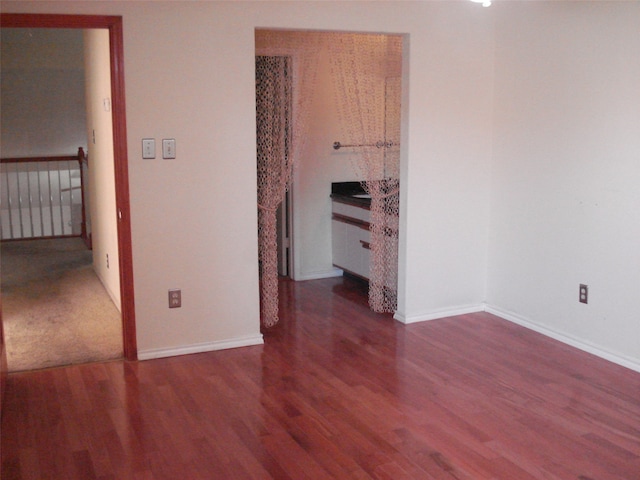 unfurnished bedroom featuring wood-type flooring