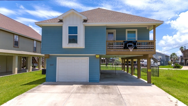 view of front of property with a garage, central AC unit, and a front lawn