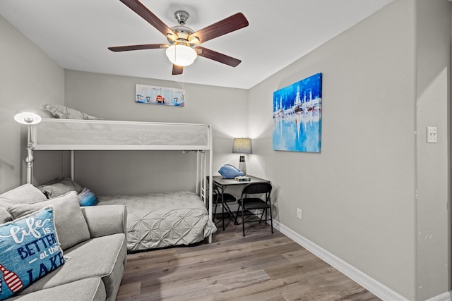 bedroom with ceiling fan and hardwood / wood-style floors