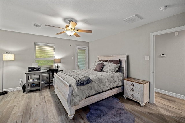 bedroom featuring hardwood / wood-style flooring and ceiling fan