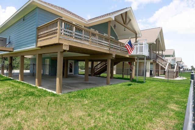 rear view of property with a patio and a yard