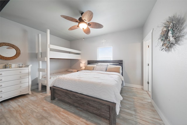 bedroom featuring light hardwood / wood-style floors and ceiling fan