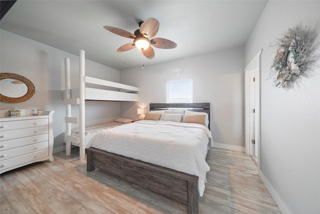962 Driftwood Dr, Crystal Beach, TX 77650 - bedroom featuring baseboards, ceiling fan, and light wood-style floors