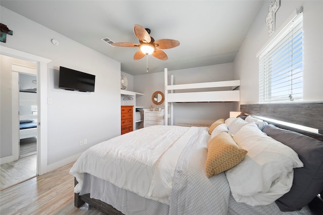 bedroom with light hardwood / wood-style flooring and ceiling fan