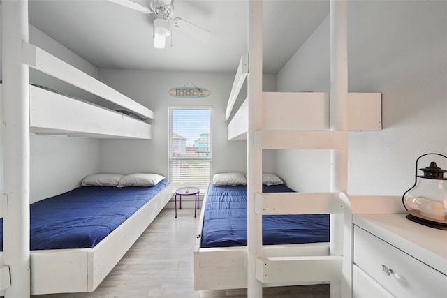 bedroom with light hardwood / wood-style flooring and ceiling fan