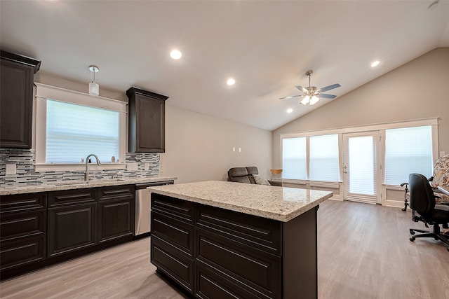 kitchen with vaulted ceiling, dishwasher, ceiling fan, and light wood-type flooring