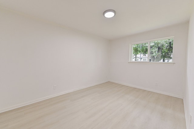 spare room with light hardwood / wood-style floors