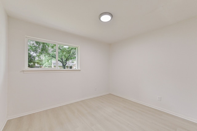 spare room featuring light hardwood / wood-style flooring