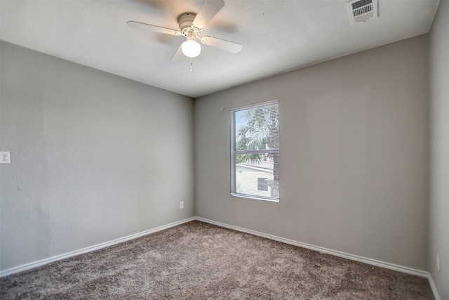 empty room featuring ceiling fan and carpet flooring