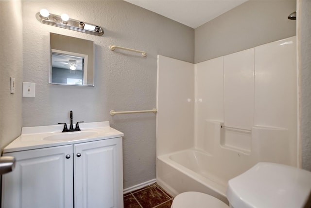 full bathroom featuring vanity, tile patterned flooring, shower / washtub combination, and toilet