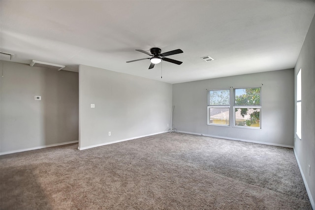 carpeted spare room with ceiling fan