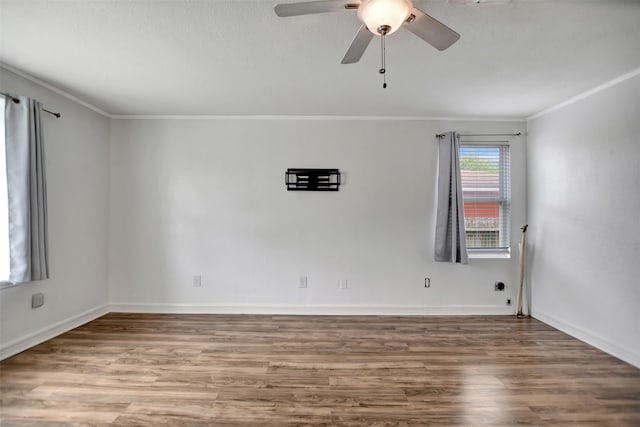 empty room with crown molding, hardwood / wood-style floors, and ceiling fan