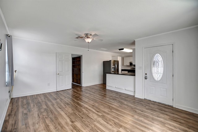 foyer entrance featuring ornamental molding, ceiling fan, and light hardwood / wood-style flooring