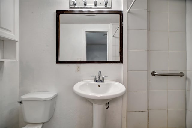 bathroom with sink and toilet